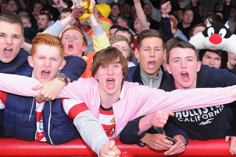 Doncaster fans celebrate after gaining automatic promotion from Division One at the end of the npower League One match between Brentford and Doncaster Rovers at Griffin Park on April 27, 2013.