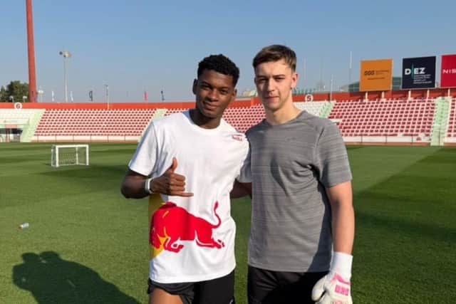 Doncaster-born Kian Johnson pictured with UAE international Yahya Al-Ghassani.