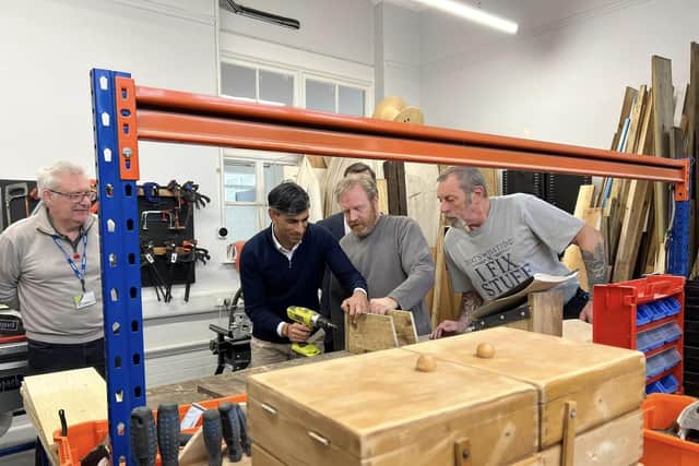 The PM tried his hand at a spot of woodwork during his visit to Doncaster.