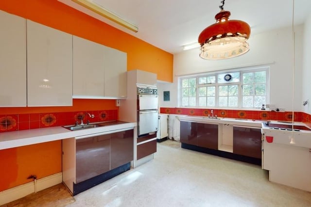 A spacious kitchen with fitted units and a hint of the 70s about it....