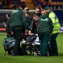 Louie Marsh is taken off on a stretcher.