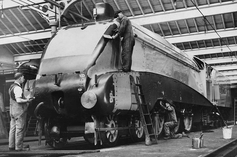 The LMS ( London Midland and Scottish Railway) Sir Nigel Gresley designed Jubilee Class 5552 Silver Jubilee 4-6-0 express steam locomotive with A4-style streamlining being painted at the Doncaster railway works on 31 October 1935.