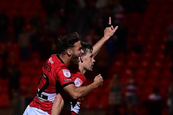 Joe Ironside celebrates his first Doncaster Rovers goal with Tyler Roberts.