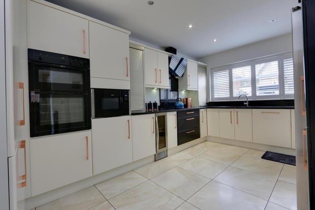 The modern fitted kitchen has integrated appliances.
