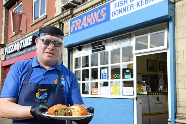 Paul Sung, owner, pictured outside Franks, with his Battered Chip Butty.
