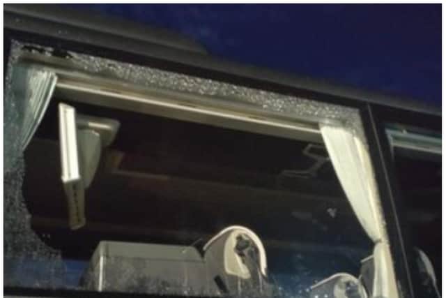 Windows were smashed after Rochdale fans pelted supporters club buses with bricks.