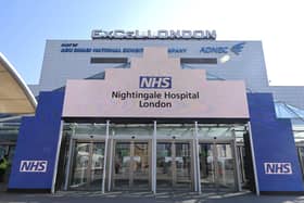 Newly installed signage for the field hospital to be known as the NHS Nightingale Hospital being created at the ExCeL London exhibition centre in London. (Photo by Glyn KIRK / AFP)