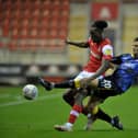 Shane Blaney of Doncaster Rovers tackles Rotherham United's Freddie Ladapo. Picture: Tony Johnson.