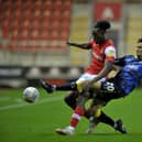 Shane Blaney of Doncaster Rovers tackles Rotherham United's Freddie Ladapo. Picture: Tony Johnson.