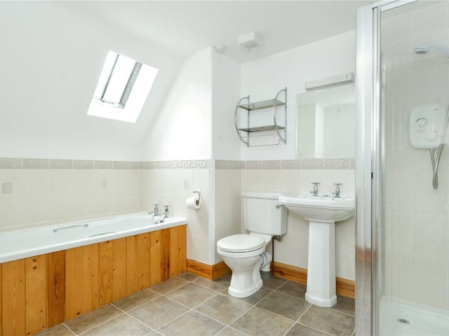 The main bathroom has a bath and separate shower room.
