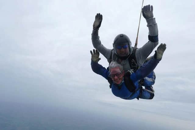 A staff member skydives for the NHS 75 in October.