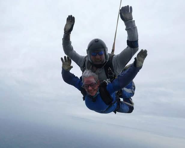 A staff member skydives for the NHS 75 in October.