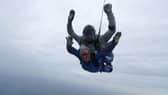 A staff member skydives for the NHS 75 in October.