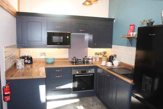 The open plan kitchen offers all mod cons.