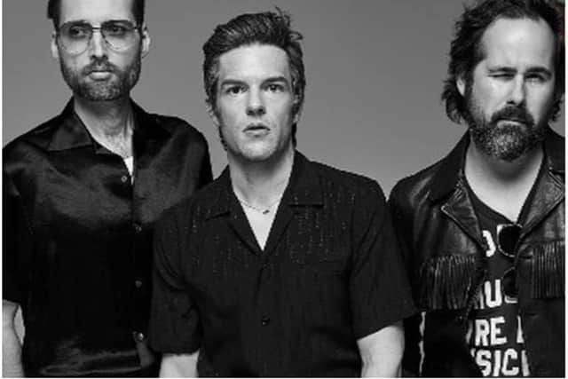 Brandon Flowers (centre) of The Killers says he can't wait to come to Doncaster.