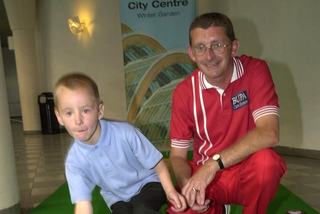 Junior star Dylan Thompson(6) from Leeds, practises at Ponds Forge with former world champion John Price at the World Bowls launch in September 2003