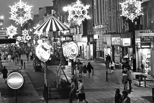 Christmas shoppers and lots of festive lights in this 1983 photo.