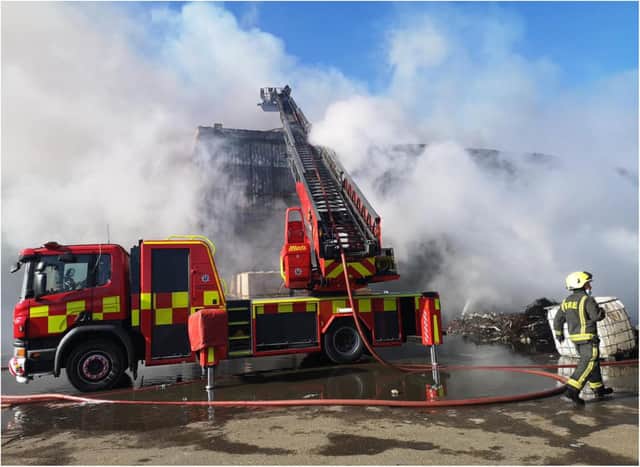 The fire continues to rage at the Morris Metals plant. (Photo: SYFR).