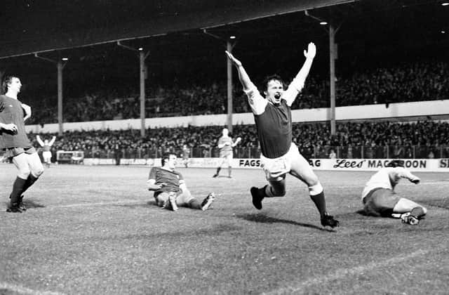 Joe Harper wheels away after beating Ray Clemence with what turned out to be the winner against Liverpool in September 1975