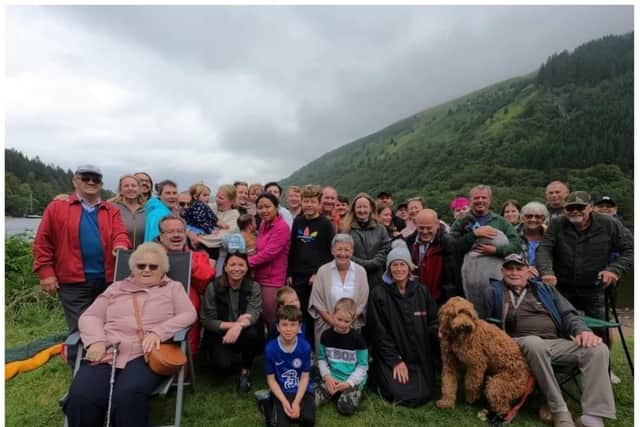 The family were cheered on by other family members from the banks.