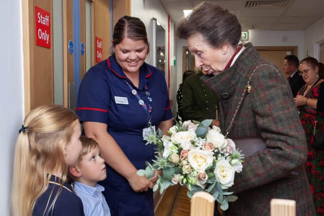 The Princess Royal was presented with flowers by young visitors on her tour of DRI.