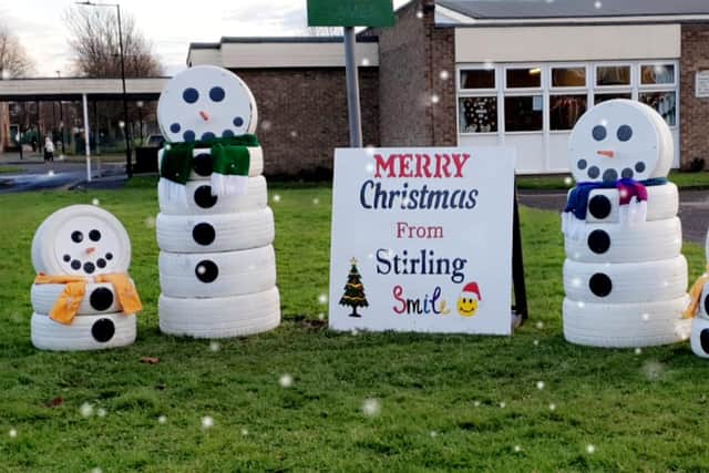 The snowmen family are spreading festive cheer.