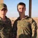 Luke and Tom serving together