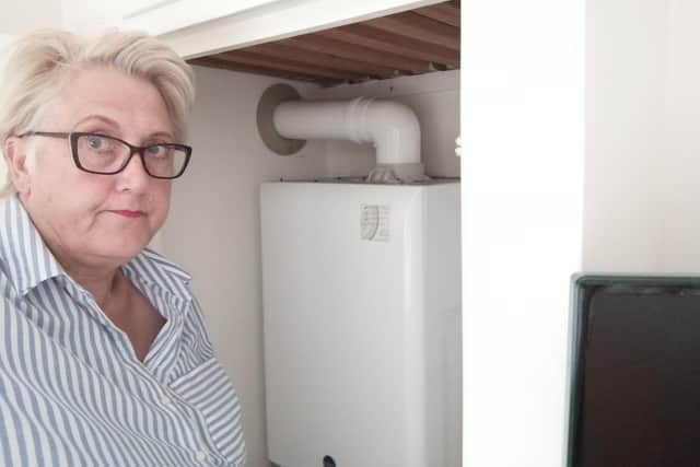 Jackie Jobling with the boiler at home in Skellow. The water pressure is too low for to have a bath when she gets home from a nursing shift at Doncaster Royal Infirmary