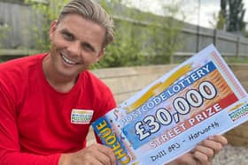 Lottery ambassador Jeff Brazier with one of the Harworth winners cheque