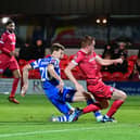 Doncaster Rovers striker Joe Ironside slots home the winning goal against Accrington Stanley.