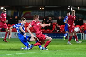 Doncaster Rovers striker Joe Ironside slots home the winning goal against Accrington Stanley.