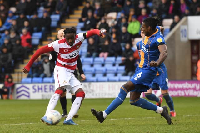 Devante Cole has a shot at goal during Doncastre Rovers' match at Shrewsbury over the weekend