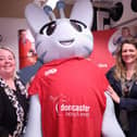 Doncaster Racecourse staff with the Active Fusion mascot.