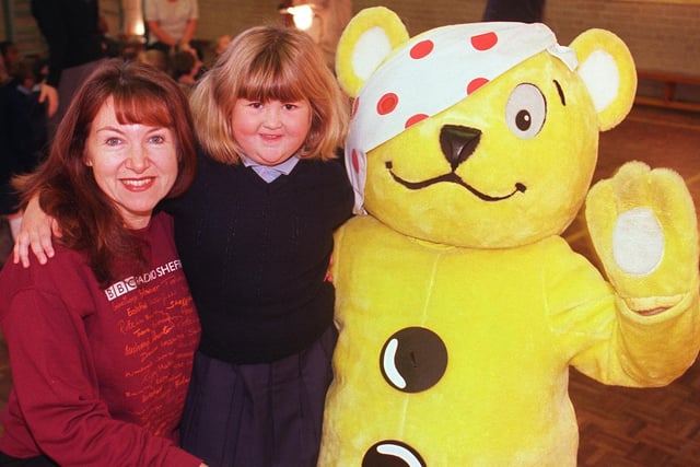 Children in Need's Pudsey Bear called into Saint Catherine's School, Pitsmoor for a pre-children in need visit. Radio Sheffield's Tricia Cooper with 5 year old Siobhan O'Mally and Pudsey in 1999