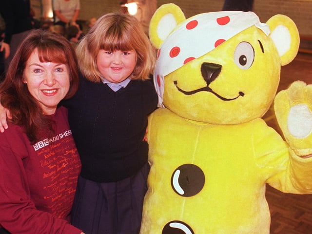 Children in Need's Pudsey Bear called into Saint Catherine's School, Pitsmoor for a pre-children in need visit. Radio Sheffield's Tricia Cooper with 5 year old Siobhan O'Mally and Pudsey in 1999