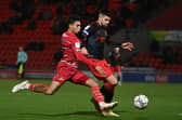 Kyle Knoyle tussles with Danny Andrew during Rovers' defeat to Fleetwood. Picture: Howard Roe/AHPIX LTD