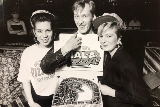 Pythagorus the Indian Python and its owner Kevin Turner tucked into one of Pappa Luigi's pizzas at Cinderella Rockerfella's one Saturday night in 1988. Pictured at the start of the competition is also Nicola Blows and Nicki Benton.