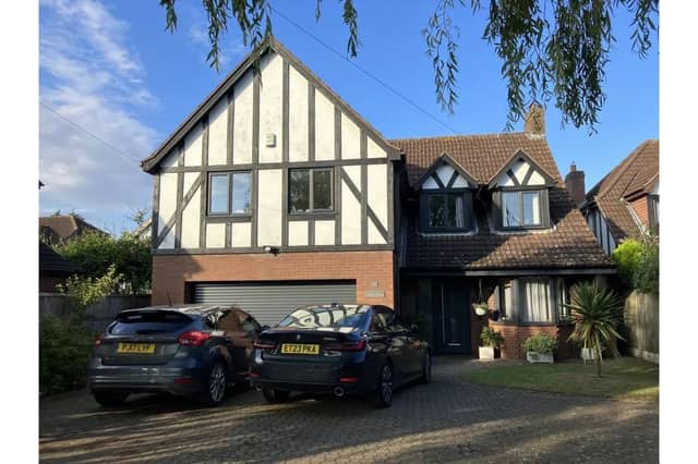 A front view of the attractive four-bedroom house.