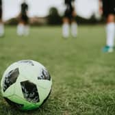 Women's football teams are refusing to play a team after a transgender player injured an opponent.