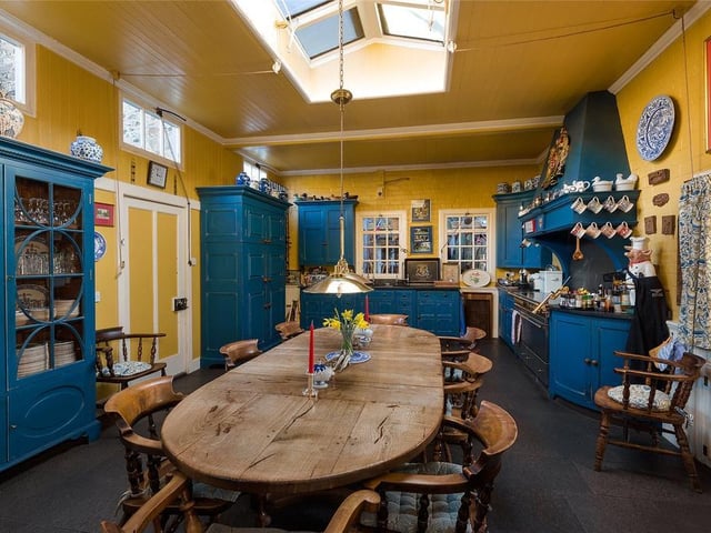 The spacious kitchen has room for informal dining.
