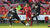 Rodrigo Vilca dribbles through the Morecambe's defence. Photo: Andrew Roe/AHPIX LTD
