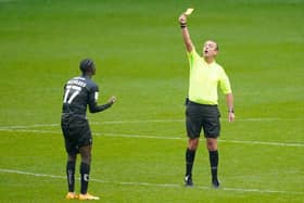 Taylor Richards shows his frustration as he is shown a yellow card against Wigan. Picture: Steve Flynn/AHPIX