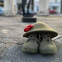 Poppies for Tickhill dressed the Buttercross with the lone soldier, the knitted poppies and boots and helmet.