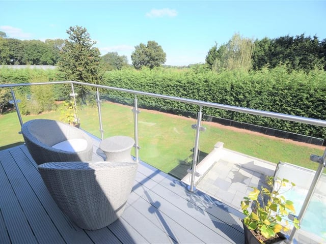 The balcony offers up amazing views into the garden, and offers a spot to relax in the sun.