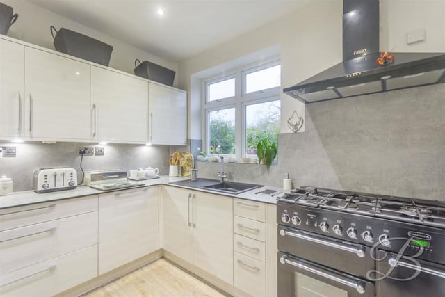 The kitchen also benefits from a Rangemaster double oven, tiled splashback, five-ring cooker, under-cabinet lighting, downlights and a central heating radiator. You won't need to change a thing!