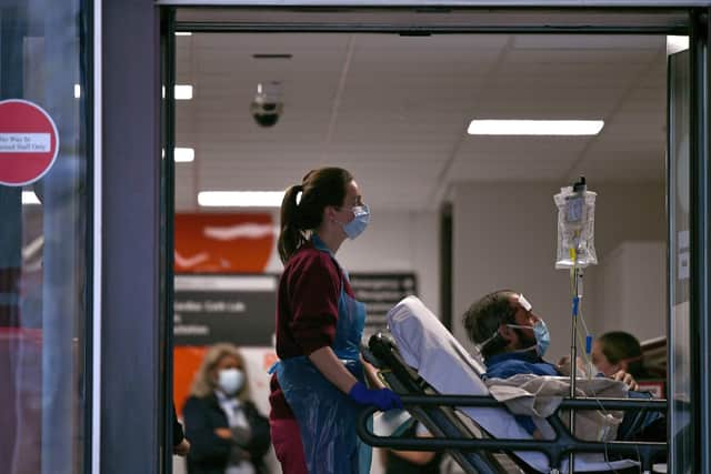 A medical professional in PPE (Photo by DANIEL LEAL-OLIVAS / AFP) (Photo by DANIEL LEAL-OLIVAS/AFP via Getty Images)