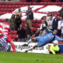 Francis Tierney tucks home the golden goal.