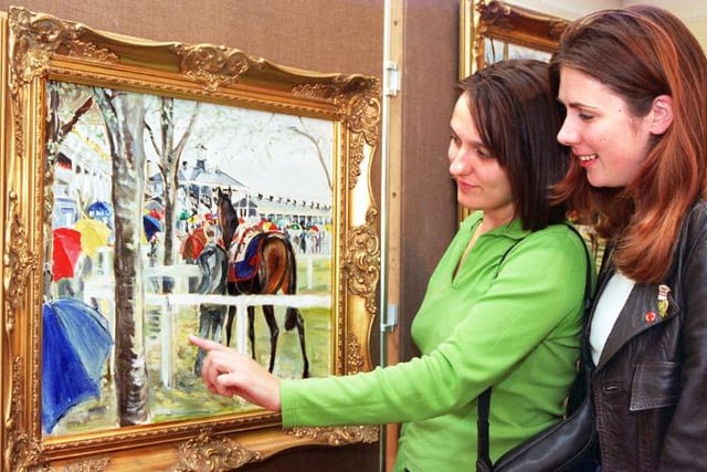 Rachel Gutteridge and Andrea Fairhurst admiring a painting by Grela Stones.