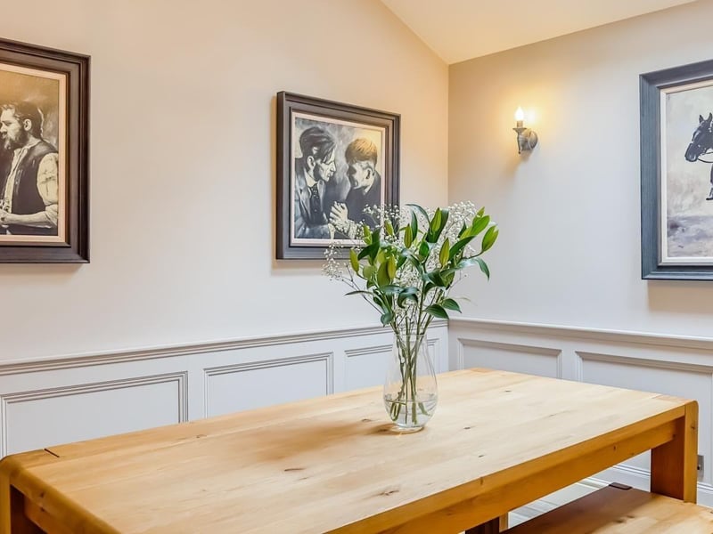 This corner of the dining room is used to display pictures.