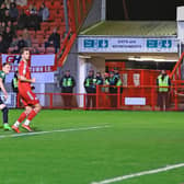 Doncaster Rovers' Caolan Lavery heads home beyond Crawley Town goalkeeper Corey Addai to give the visitors the lead.